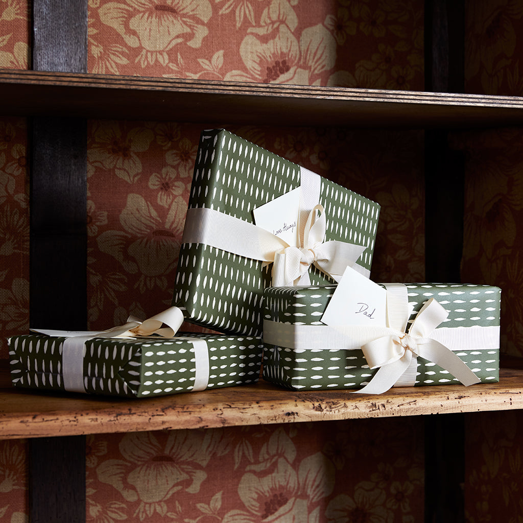 Boxes Gift Wrapped with luxury green and cream paper with thick cream ribbon