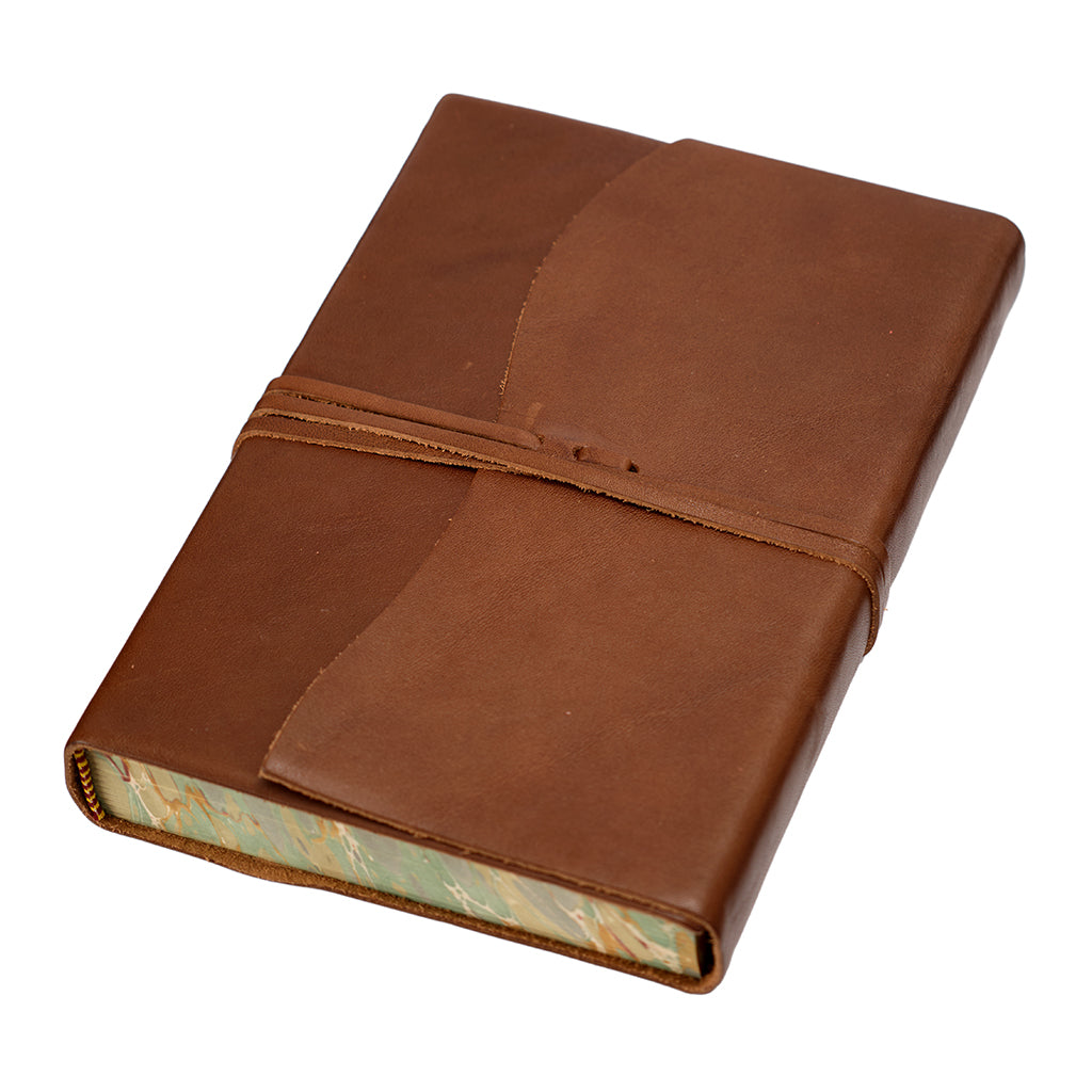 Brown leather-bound book on a white background