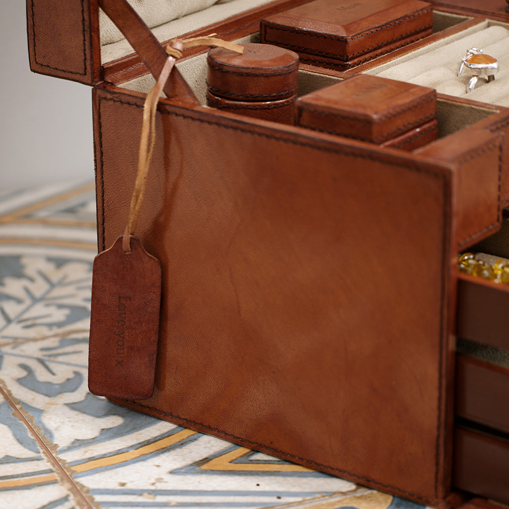 Close up of personalised leather mini tag on leather jewellery case