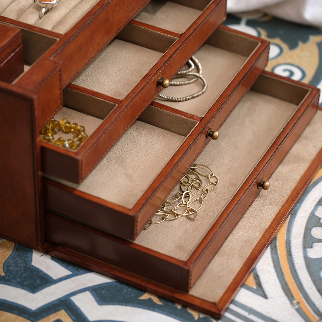 leather jewellery case with internal mirror and drawers close up of faux suede drawers