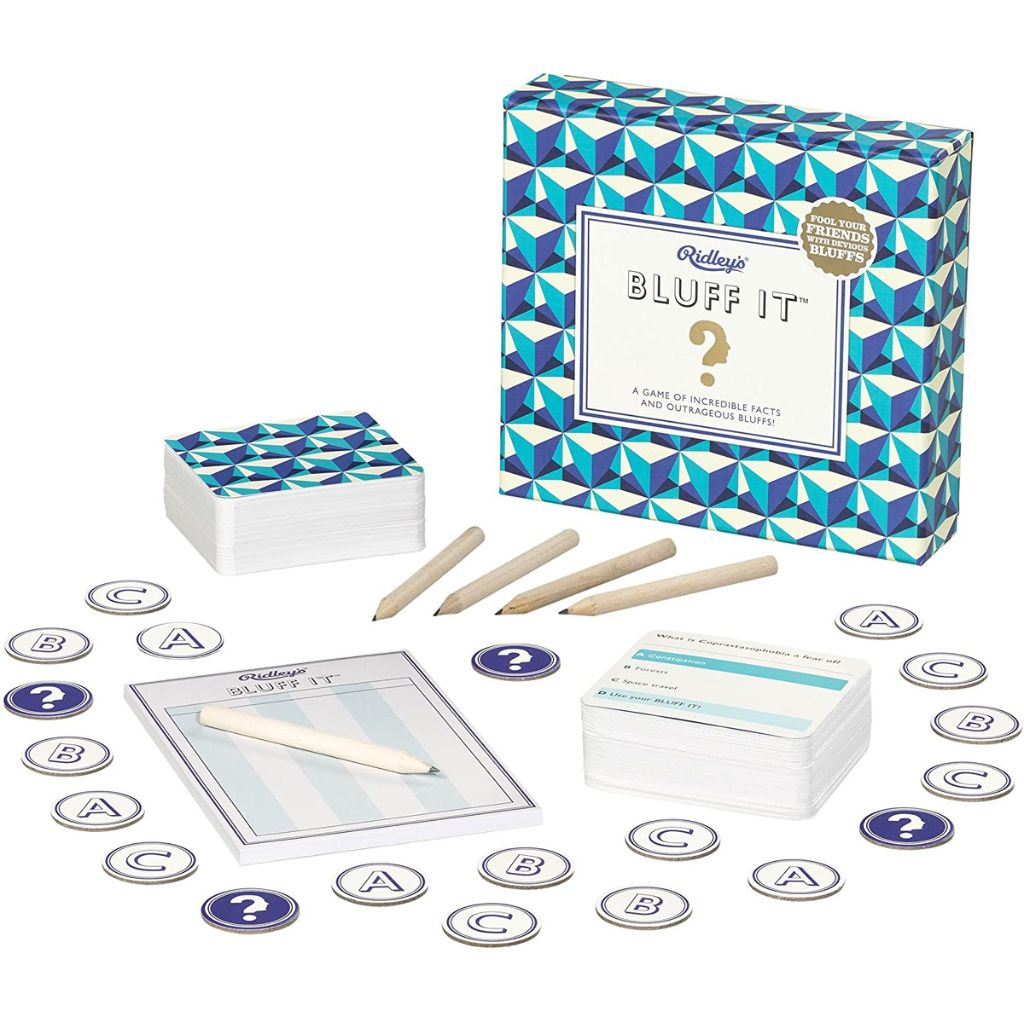 Bluff It game set with cards, markers, and instructions on a white background