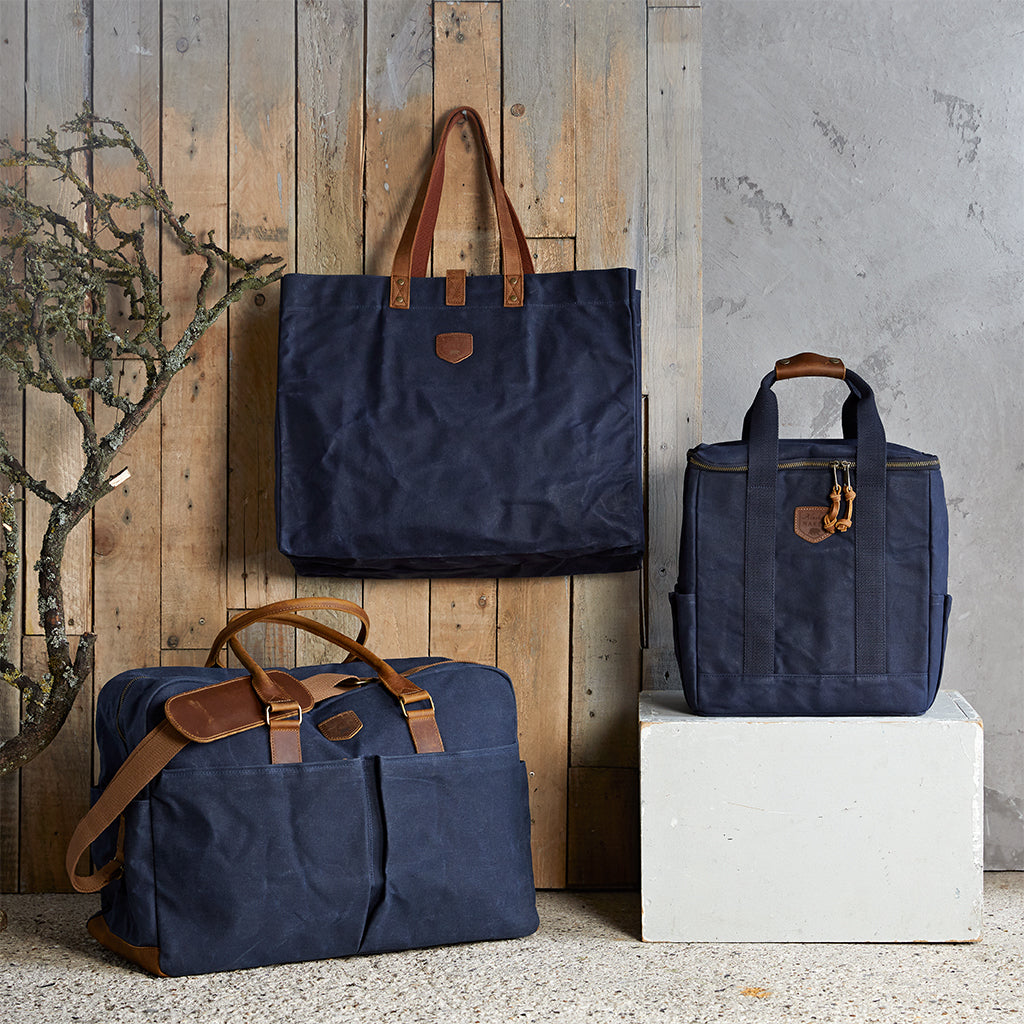 Waxed canvas travel set in navy with tote bag, cool bag and weekend bag
