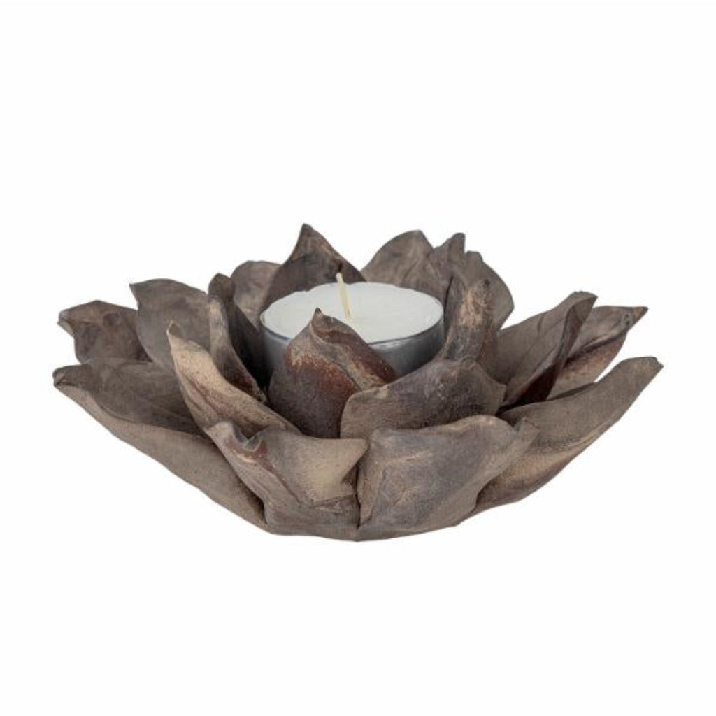 Decorative candle holder shaped like a lotus flower on a white background