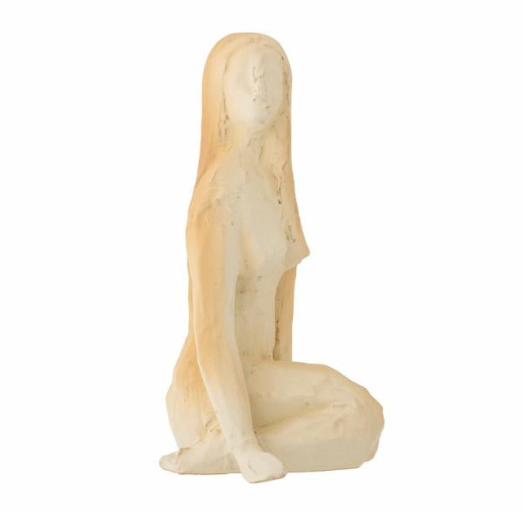 Statue of a nude figure on a white background