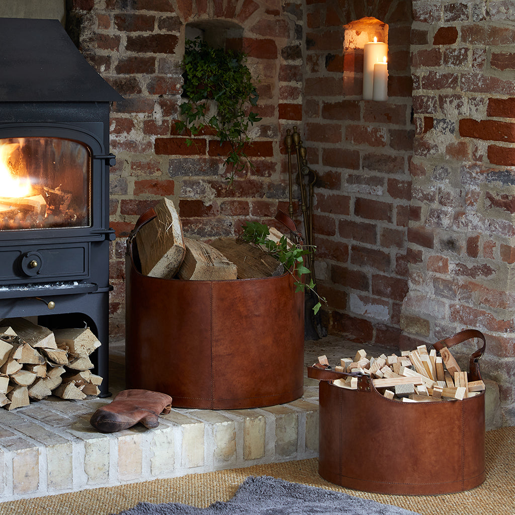 Large and small log basket in hearth with log burner