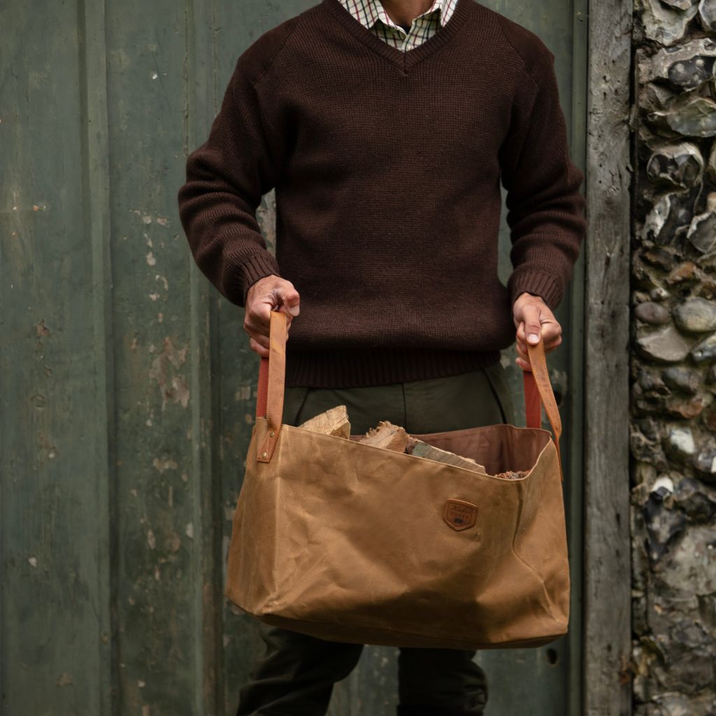 Waxed Canvas log bag being carried