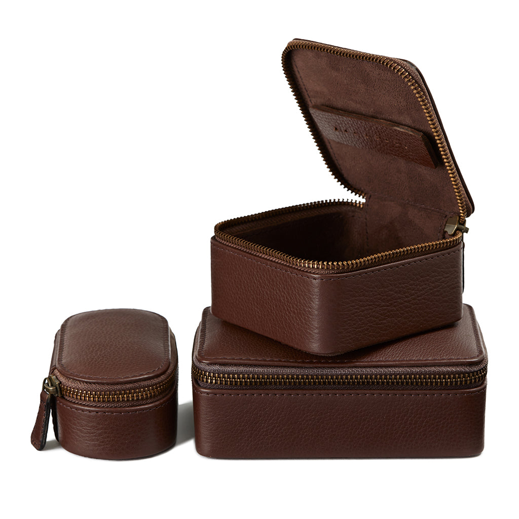 set of three brown travel cases