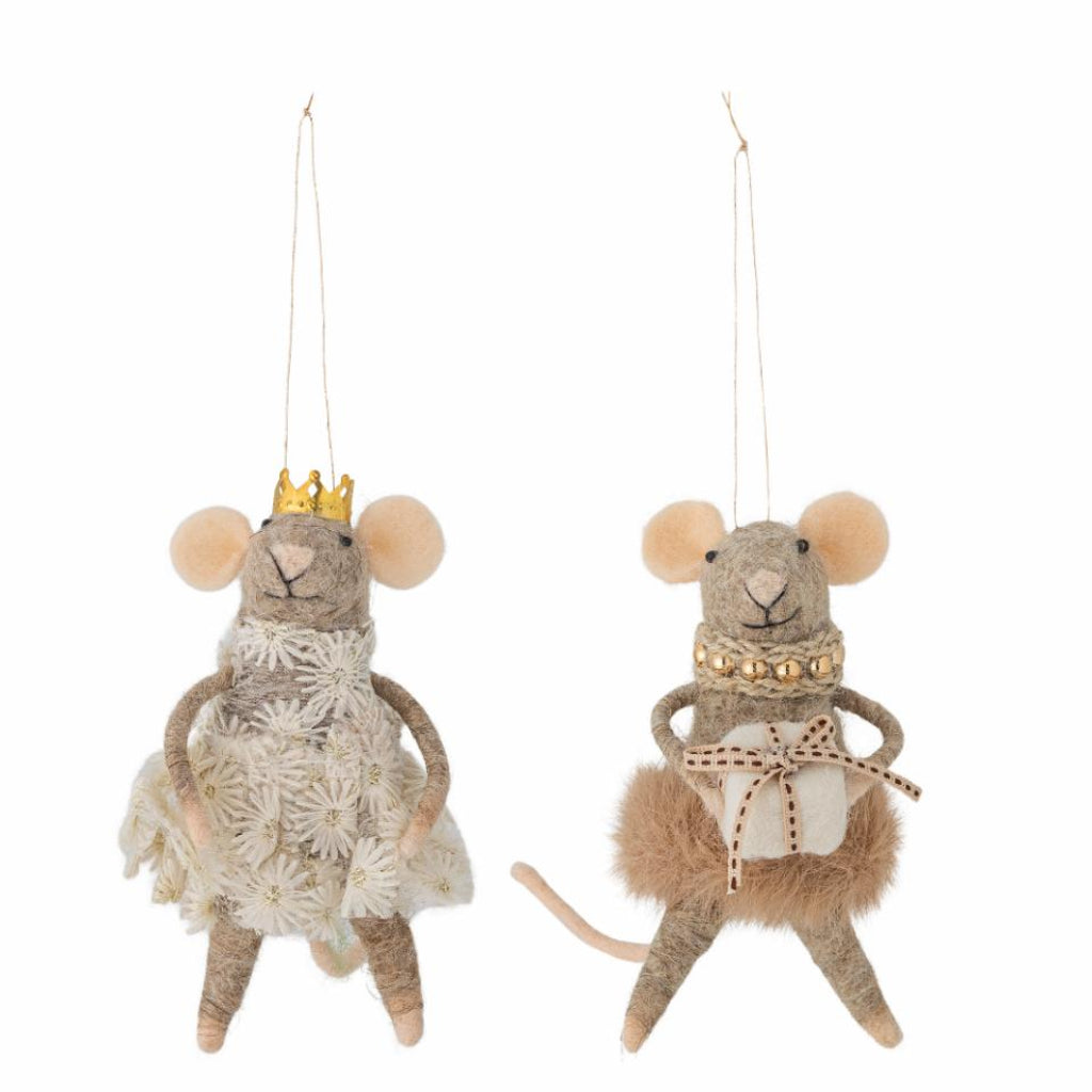 Two decorative mouse figurines with costumes and crowns on a white background