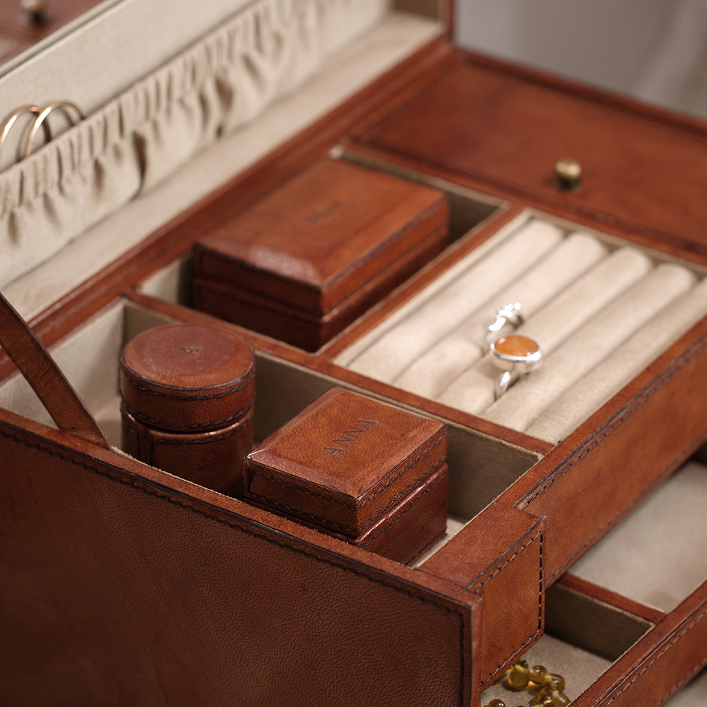 leather jewellery case close up of top section with personalised mini boxes 
