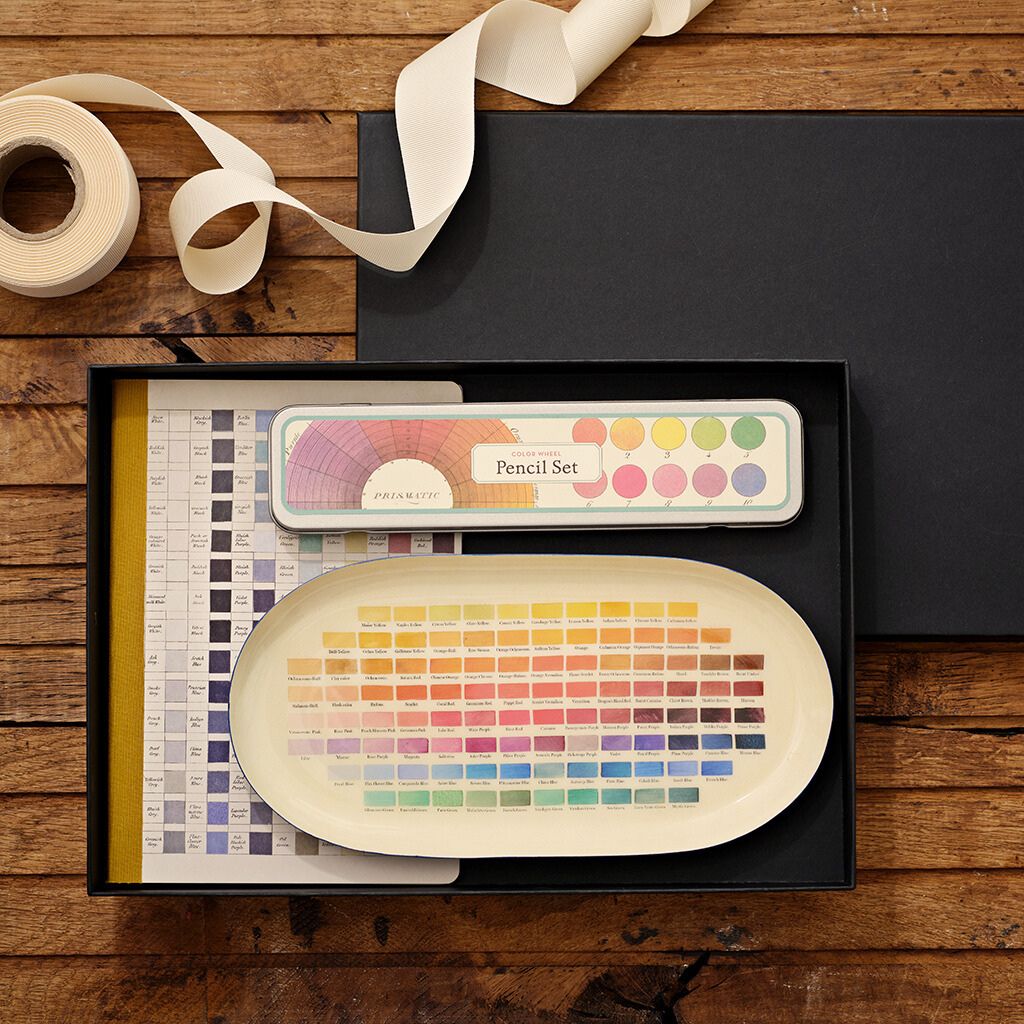 Enamel try with note book and pencil set presented in a box tied up with a cream ribbon