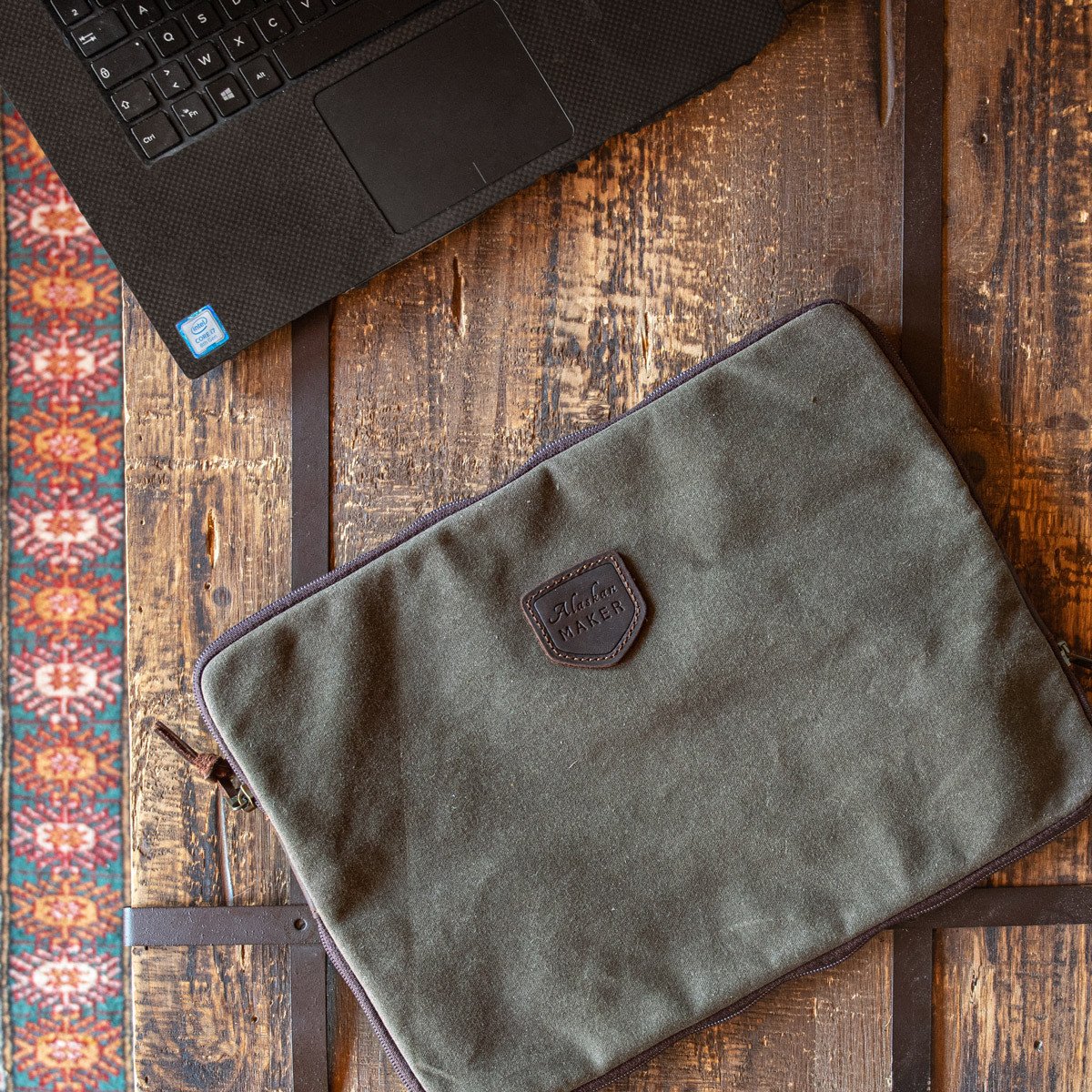 Waxed Canvas Laptop sleeve in khaki on desk with lap top 