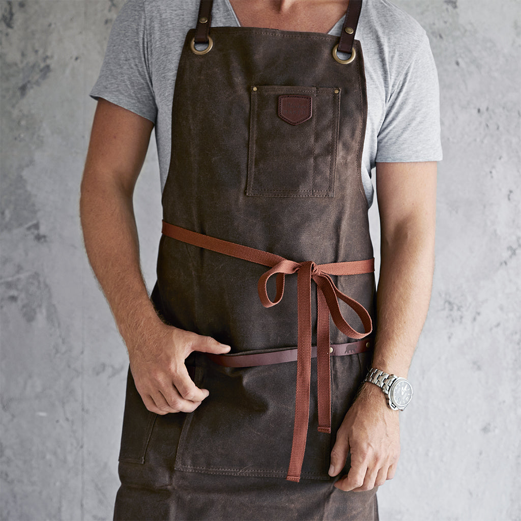 Waxed canvas and leather apron tied at the front