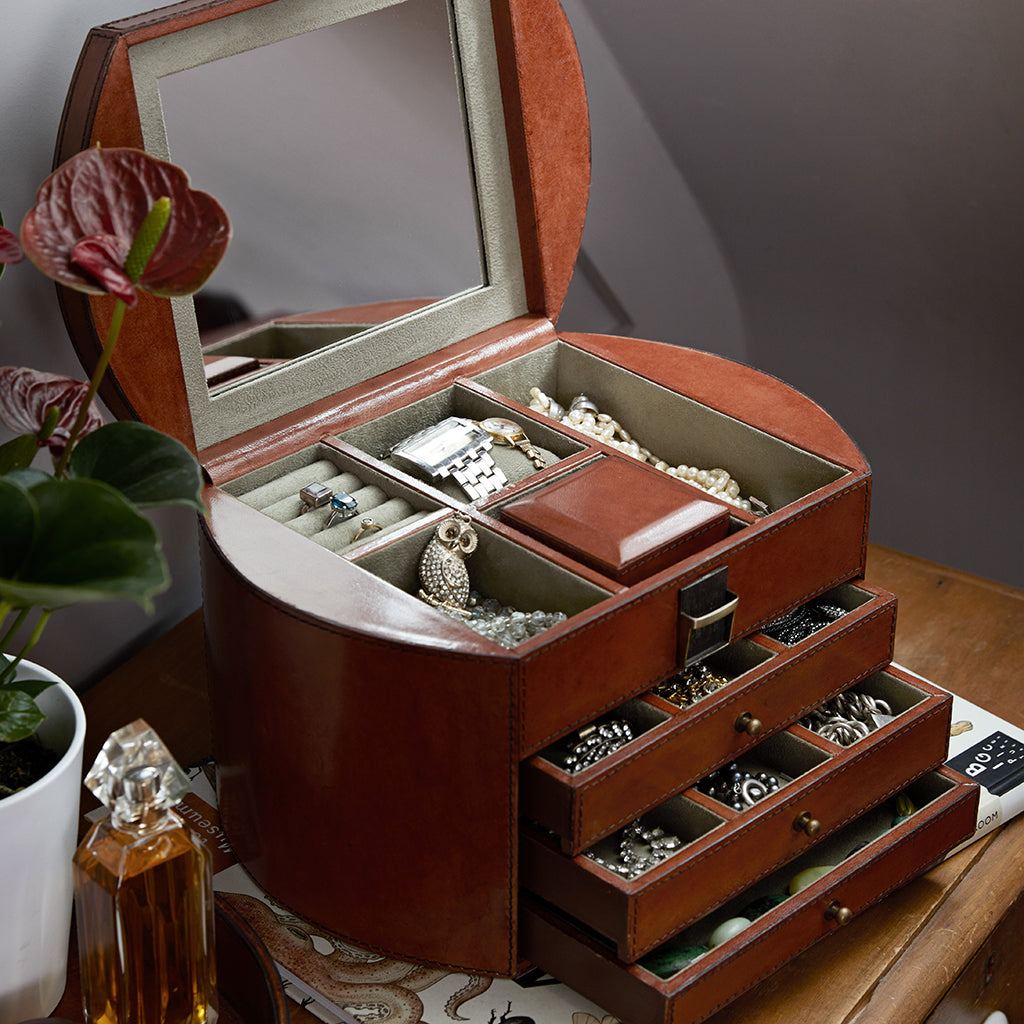 Three drawer leather jewellery chest with mirrored lid  open showing small square internal removable jewellery box