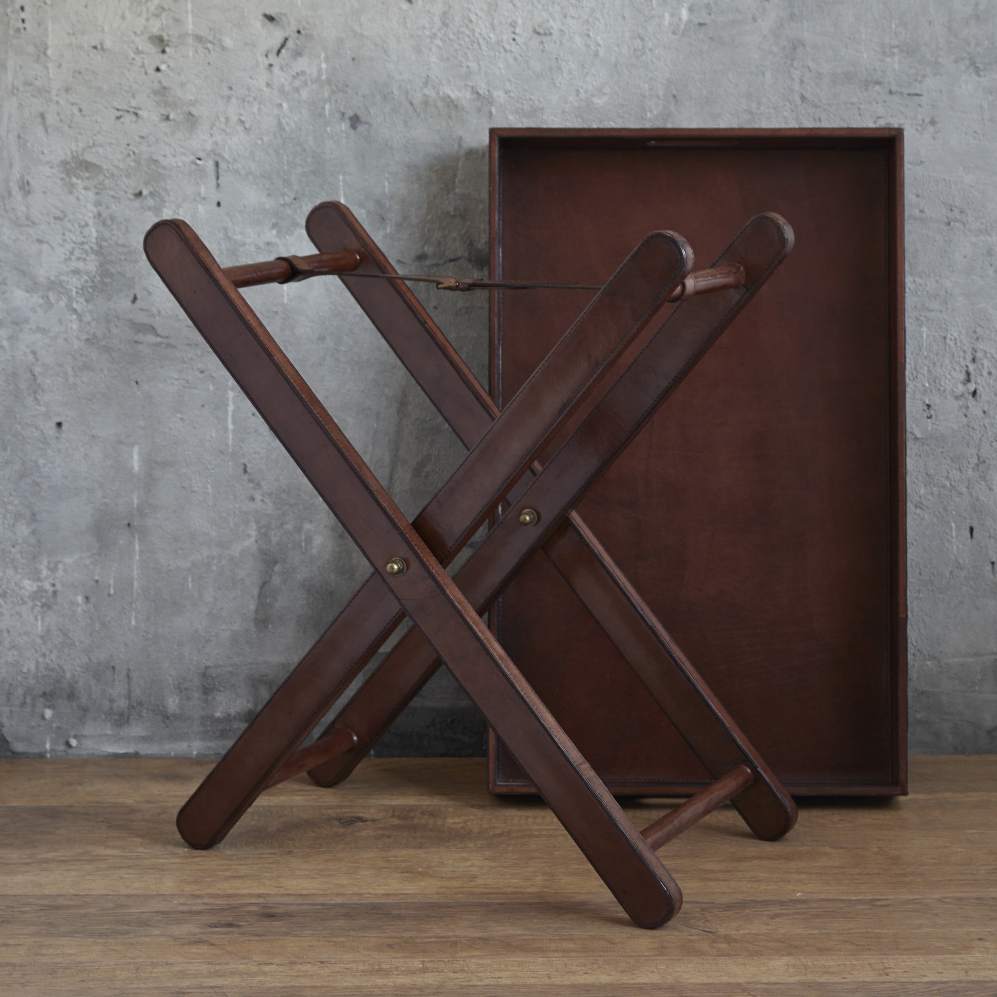 Leather removable butler tray shown off the legs as two separate items.