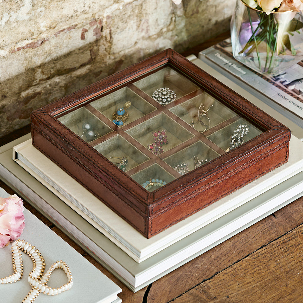 Leather trinket organiser with a hinged glass lid, storage for rings and earrings
