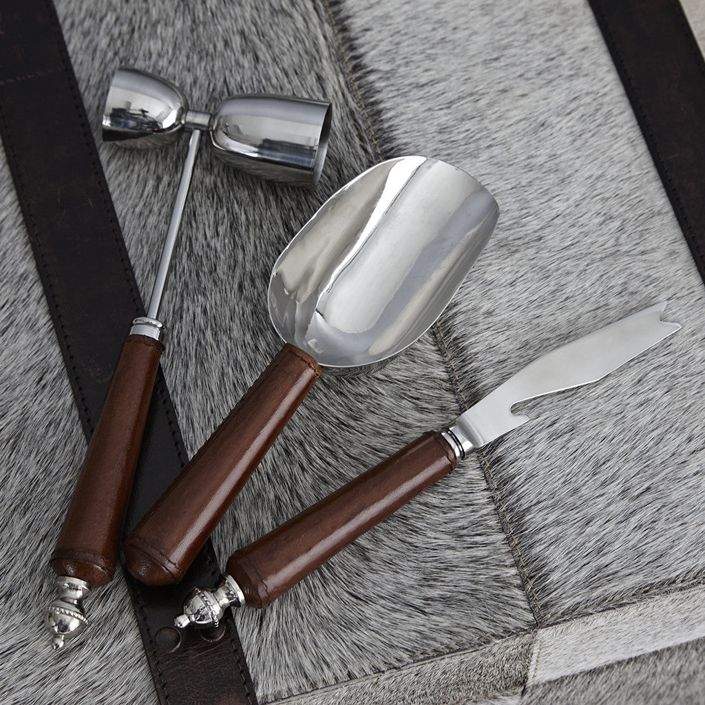 three leather handled cocktail tools for a bar set