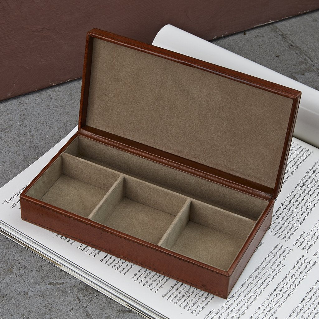 Leather cufflink box inside to show the four individual compartments.