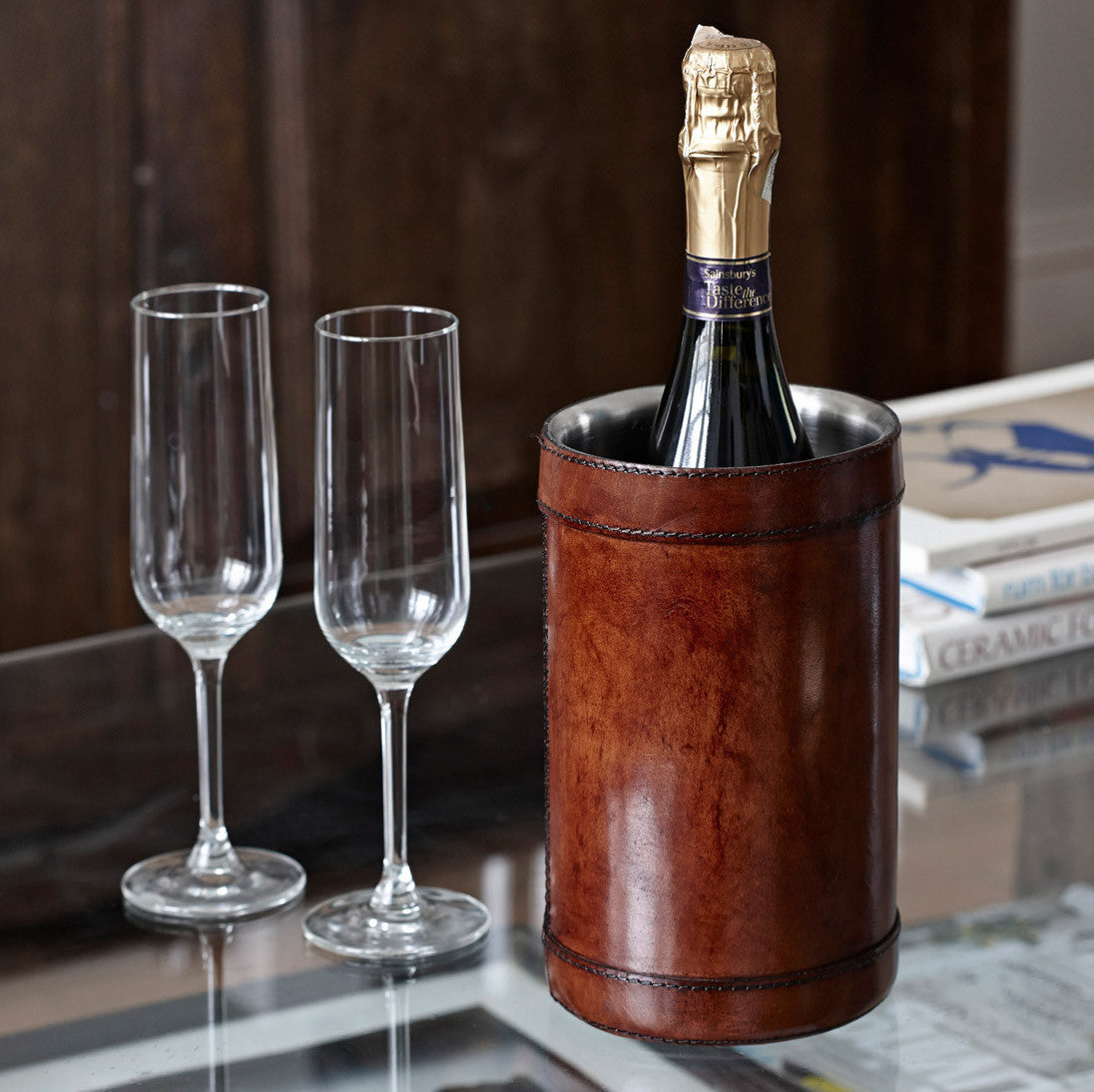 Leather wine cooler in conker brown with a bottle of wine