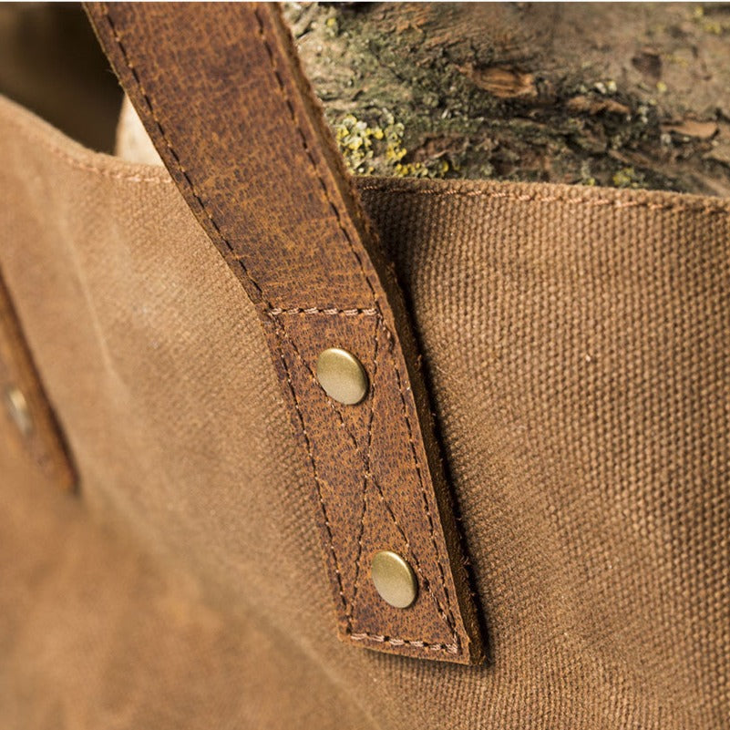 leather handled log bag close up