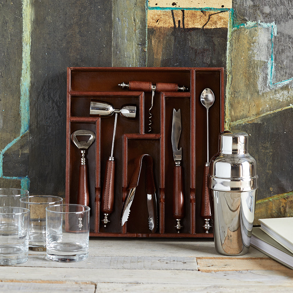 Drawer of the leather cocktail mixology box to show the included bar tools, cocktail shaker and glass tumblers