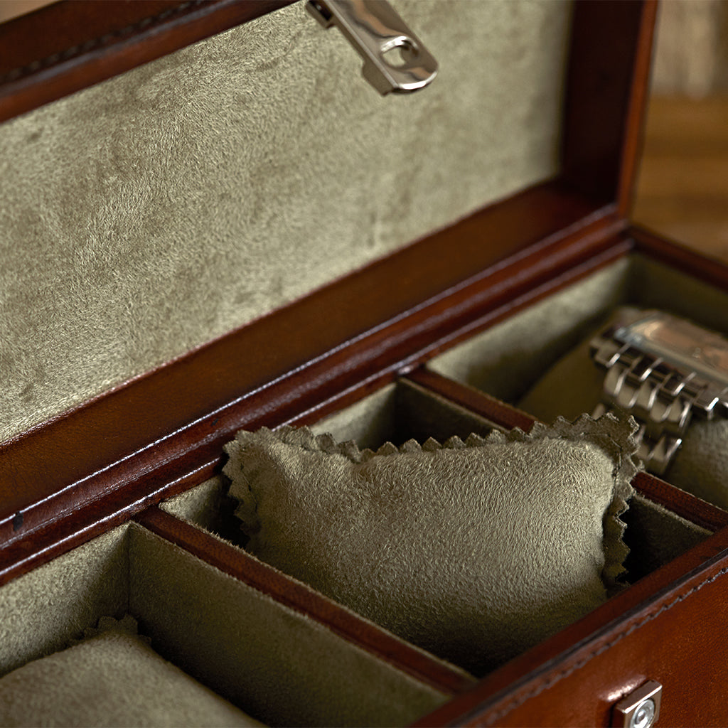 Leather watch box for three open to show the detail of the faux suede and inner watch cushions