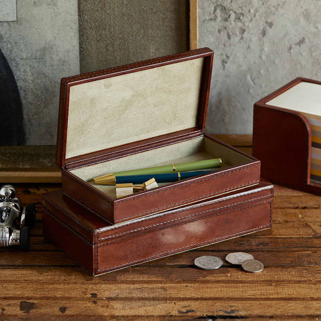 Pair of leather memento keepsake boxes, smaller box open with pens and cufflinks