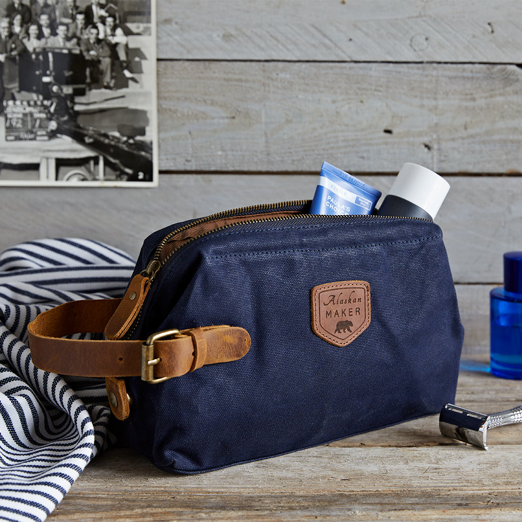navy waxed canvas toiletry bag with mans toiletries