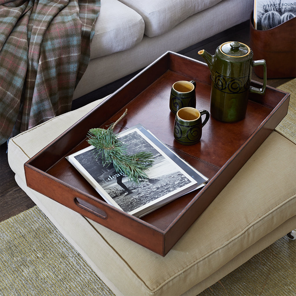 leather ottoman tray on an ottoman footstool