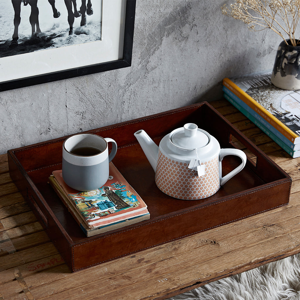 Leather tea tray in conker brown with a tea pot and mug