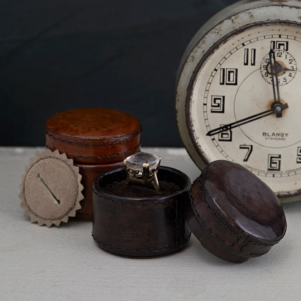 Tiny leather ring box with ring insert in dark chocolate brown and conker brown at the back of the picture