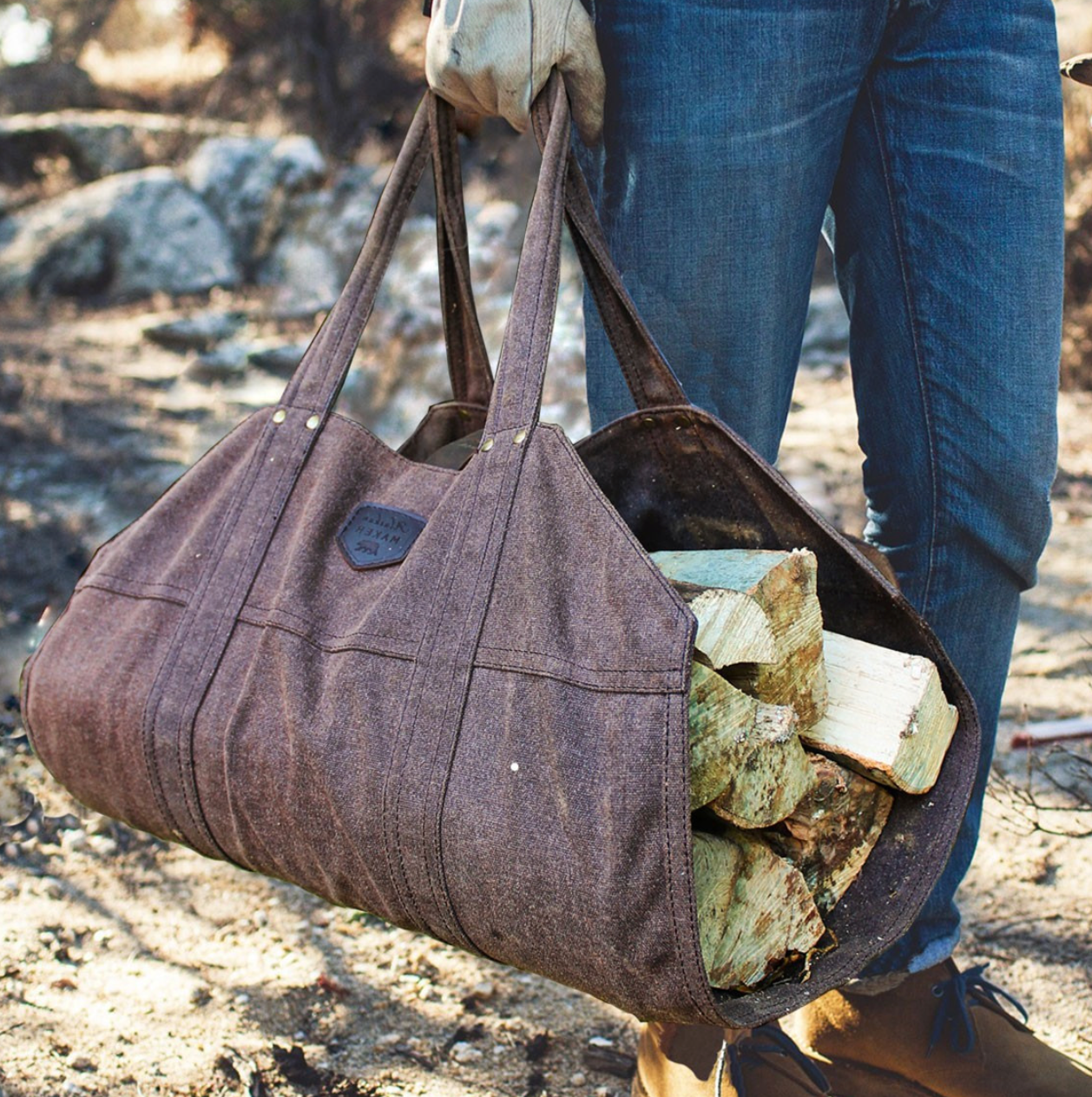 waxed canvas log carrier with logs